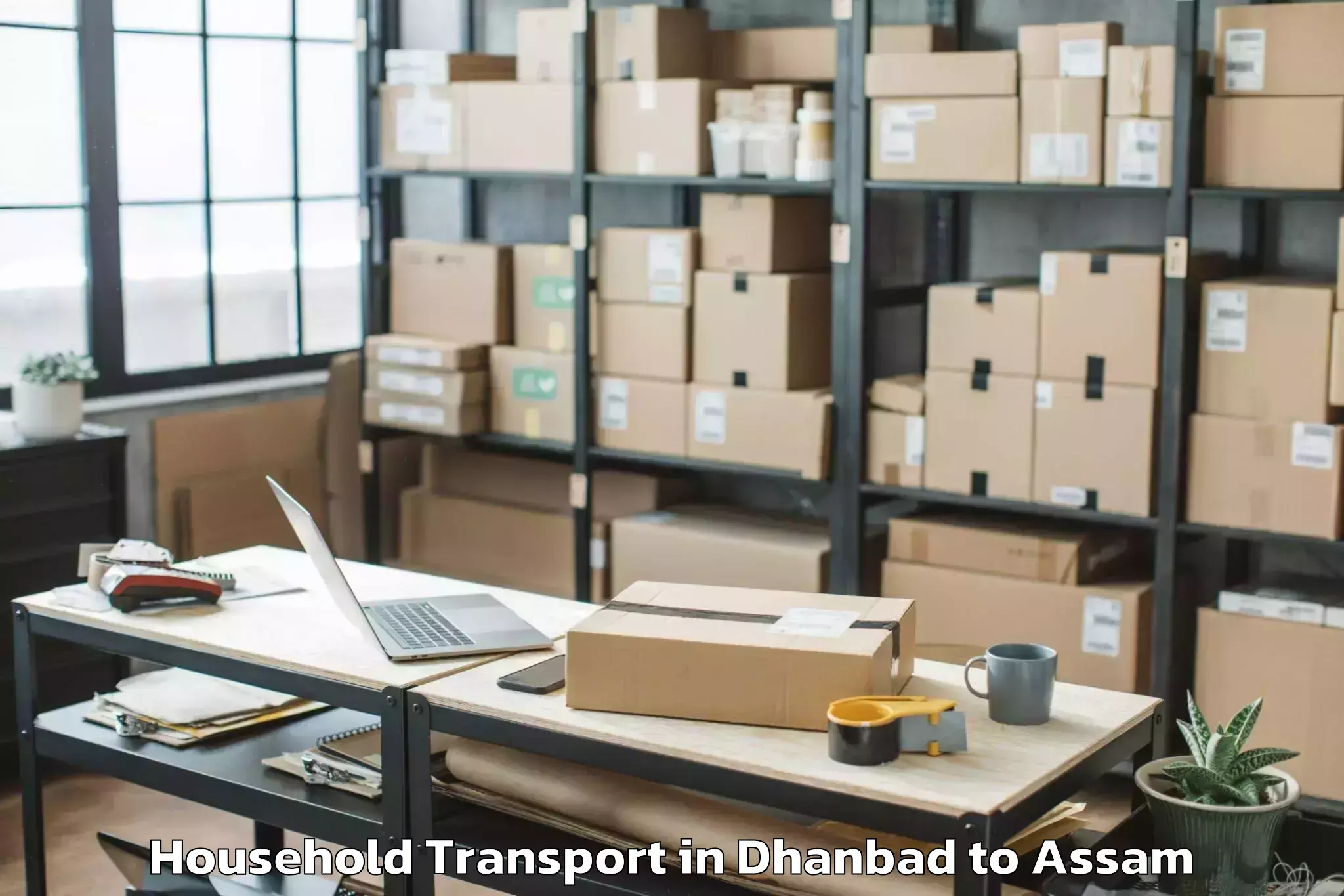 Top Dhanbad to Barpeta Road Household Transport Available